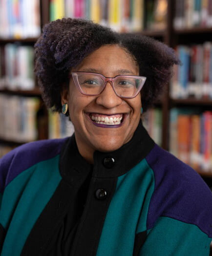 Please use this headshot for me for all media and public speaking events. Photographed at the Enoch Pratt Central Library in Baltimore, Maryland in February 2026 by Phillip Smith.